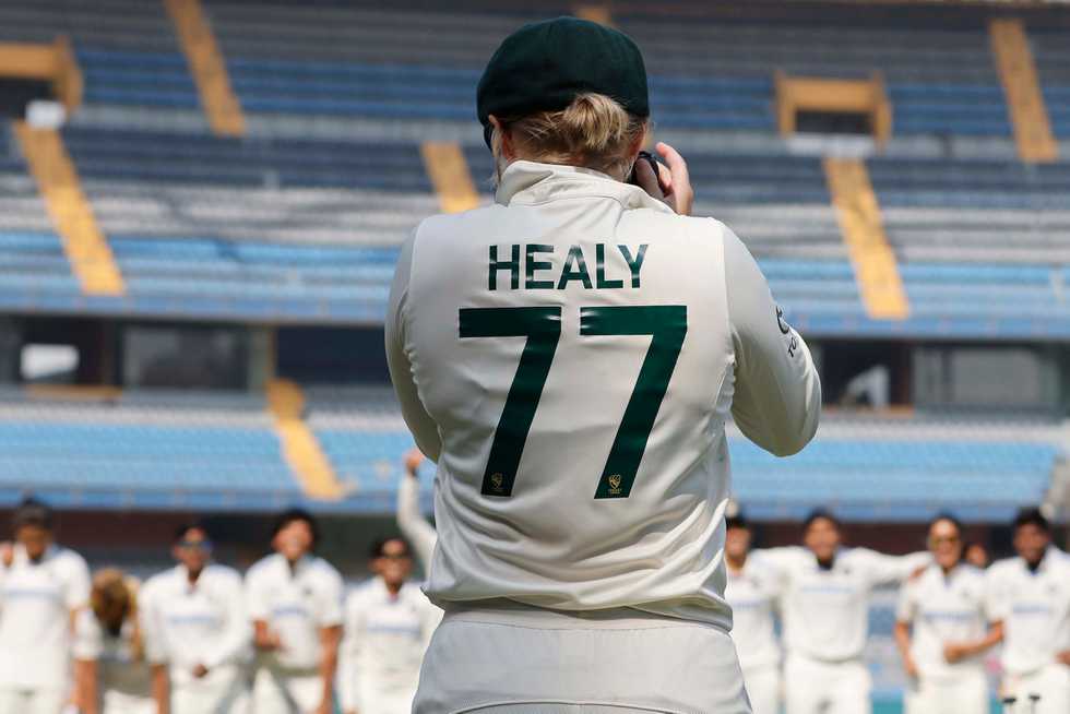 Alyssa Healy clicking the photograph of the victorious Indian team