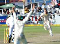 Australia's Ryan Harris celebrates as he takes the last wicket to win on day five of the third Test against South Africa in Capetown on March 5, 2014