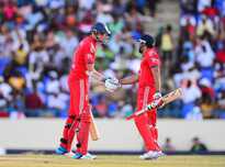 England's captain Stuart Broad (L) and Ravi Bopara celebrate their partnership as England wins the second One Day International match between West Indies and England at the Sir Vivian Richard Stadium in St John's, March 2, 2014