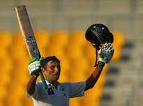 Pakistani batsman Younis Khan celebrates after scoring a century (100 runs) during the first day of the second test cricket match between Pakistan and Australia at Zayed International Cricket Stadium in Abu Dhabi on October 30, 2014