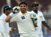 Pakistani cricket team captain Misbah-ul-Haq celebrates after winning the final day of the third and final cricket Test match against Sri Lanka at the Sharjah International Cricket Stadium, in the Gulf emirate of Shrajah on January 20, 2014